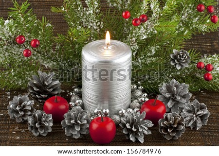 christmas composition with silver candle and decoration