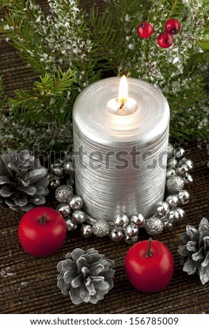 christmas composition with silver candle and decoration