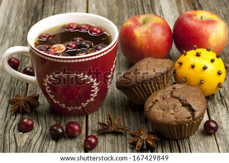 still life with tea mugs and  chocolate muffins and fruits