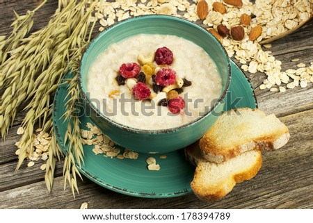 Bowl of oats porridge, healthy breakfast