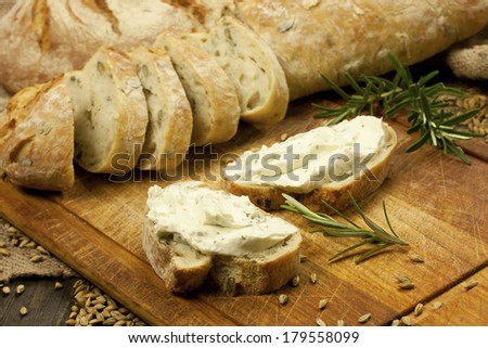 Fresh baked traditional baguette with butter