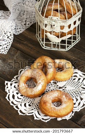 Tasty sweet donuts with icing sugar