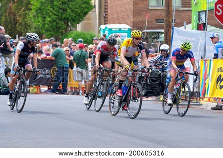 JUNE 15, 2014: Cyclists chase race leader at final stage of 2014 North Star Grand Prix in Stillwater, Minnesota. About 300 top pro cyclists from around the world compete in the prestigious event.