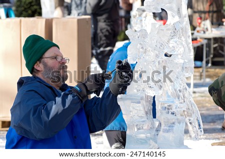 SAINT PAUL, MN/USA  JANUARY 25, 2015: Ice sculptor creates piece for competition at Saint Paul Winter Carnival. It is the nation\'s oldest winter festival attracting over 250,000 visitors a year.