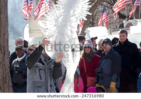SAINT PAUL, MN/USA - JANUARY 25, 2015: Ice sculptor creates piece for competition at Saint Paul Winter Carnival. It is the nation\'s oldest winter festival attracting over 250,000 visitors a year.