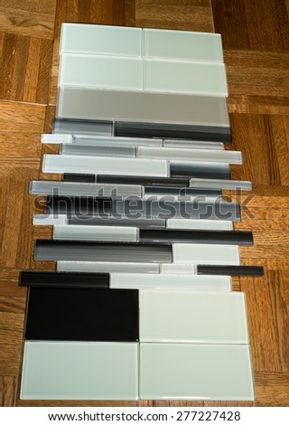 glass mosaic tile and subway tile for kitchen backsplash walls and other interior spaces against parquet flooring