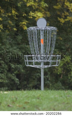 Disc golf basket or pole hole surrounded by trees
