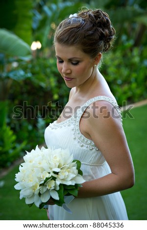 Almost Married. Beautiful young bride takes a moment to herself on her wedding day.  She is closing her eyes in a moment blissful anticipation of the day\'s event.