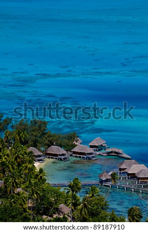 View looking down over a beautiful turquoise lagoon of bungalows. Bora Bora Island, Tahiti, Society Islands, French Polynesia.