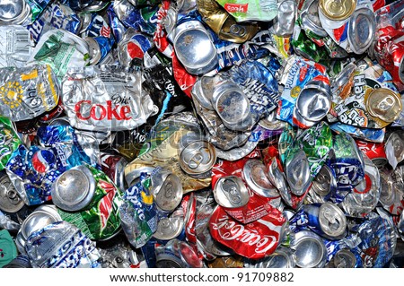 PHOENIX, AZ - APRIL 29: Crushed soda and beer cans at a recycling facility in Phoenix AZ on April 29, 2009. The cans will be shipped to an aluminum foundry.