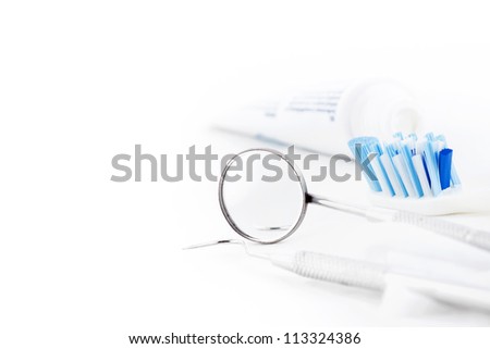 Toothbrush and dental tools on a white background Toothbrush and dental tools on a white background