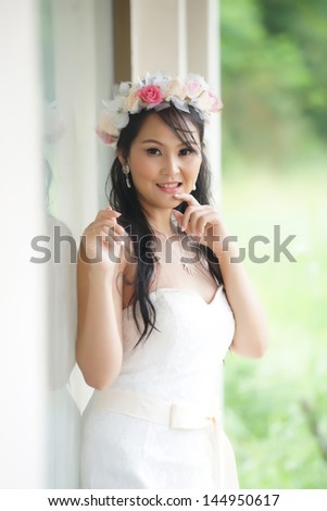 Beautiful Asian lady in white bride dress, Model is Thai Ethnicity
