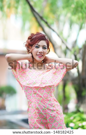 Beautiful young woman stand alone at the outdoor mall, Model is Thai Ethnicity.