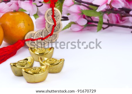 Gold ingots and copper coins with oranges and plum blossom