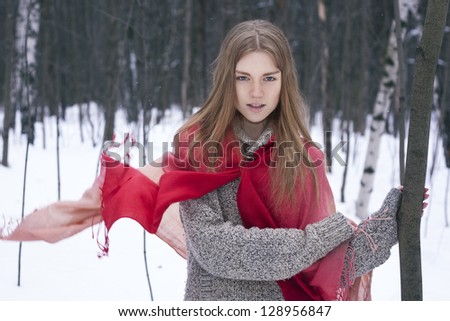 happy young woman in winter forest