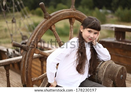 pretty preteen girl on board of english ship of 18 century