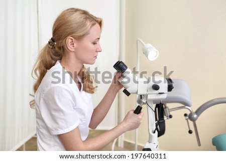 doctor blond young make microscopic investigation