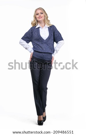 Beautiful Busyness Woman Blonde Fashion Model in long sleeve white blouse, vest and trousers
