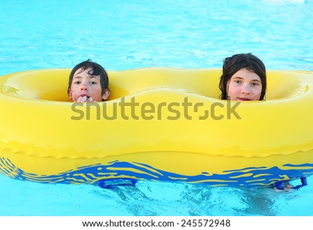 boy and girl siblings in open air water park in egypt