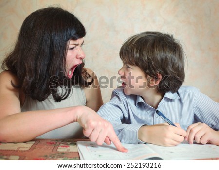 mother try to help her son to do difficult task exercise and quarrel