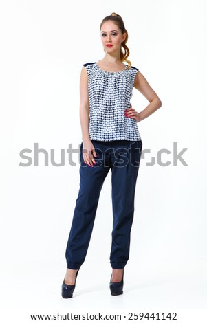 beautiful business woman fashion model girl in summer printed blouse and trousers