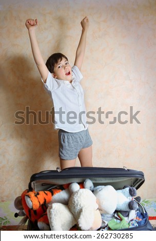 preteen handsome boy jump with joy with appretiation of holiday trip