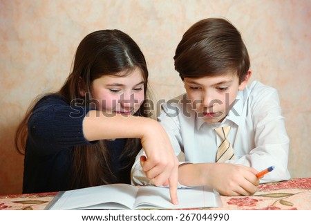 siblings sister help her brother to do his difficult homework