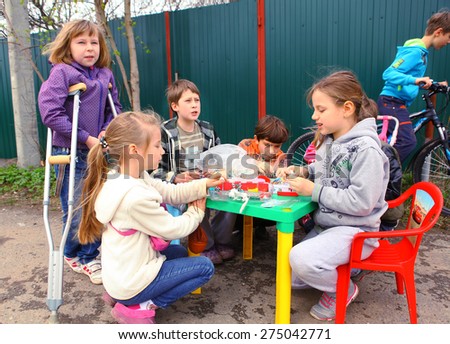 RUSSIA, MOSCOW, MAI 02, 2015: Country children trying to organise their own business, trading hand made rubber band toys, Mai 02, 2015.