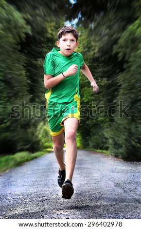 teenager boy in sportswear run on the country road