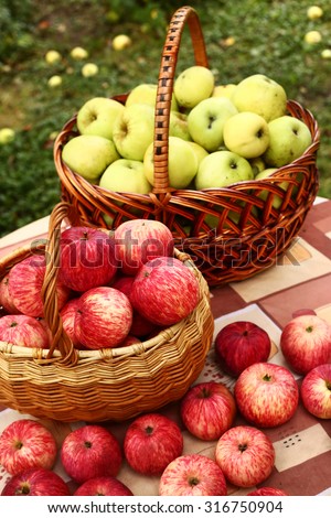 fresh  ripe red cut apples in basket on the table