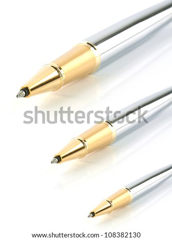gold shining pens isolated on white background