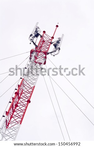 Telecommunication tower used to transmit television and 3g signals isolated on white