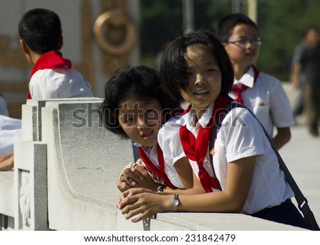 PYONGYANG, NORTH KOREA - CIRCA APRIL 2012: kids in the park near Kim Il-sung Mausoleum (Kumsusan Memorial Palace) during the celebrating centenary birth of President Kim Il Sung.