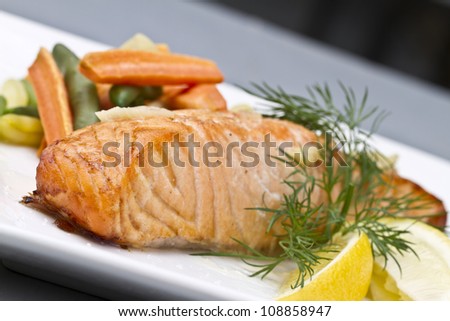 grilled salmon with garlic butter, lemon, fresh vegetables and dill