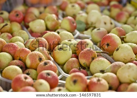 fresh small apples on food market