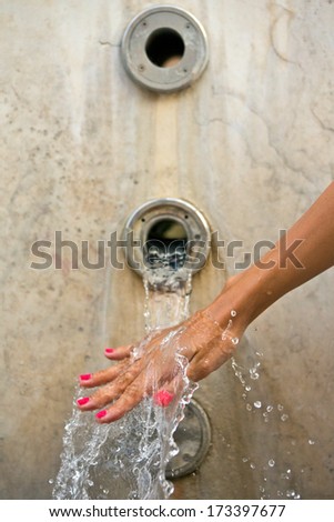 woman hand and water splash