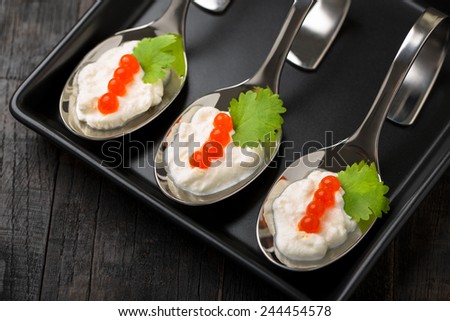 salmon caviar and creamy cheese elegant silver spoons