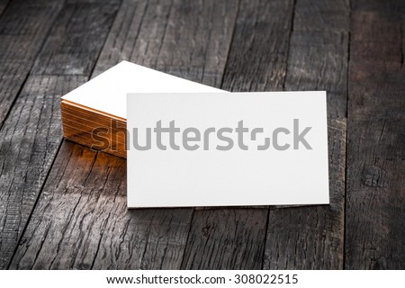 thick white cotton paper business card mock up with brassy foil on the edges