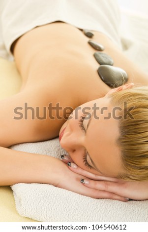 young woman at day spa relaxing