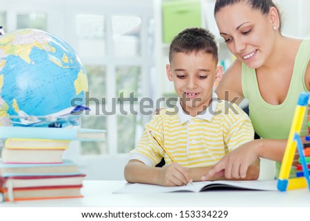 mother and son doing homework