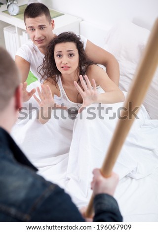 angry husband holding the baseball bat, a woman and a man beg for mercy