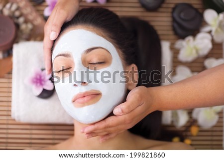 woman having facial mask at beauty salon woman having facial mask at beauty salon