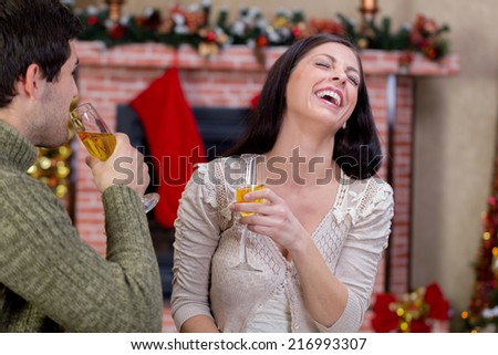 love couple in Christmas night toasting with champagne
