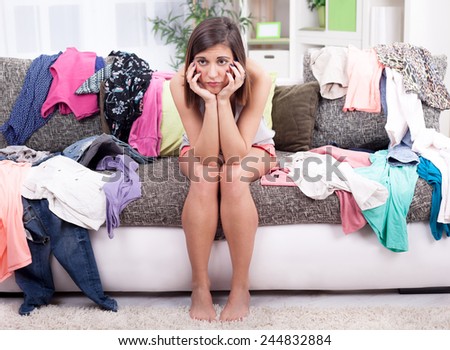 depressed young girl does not know what to wear