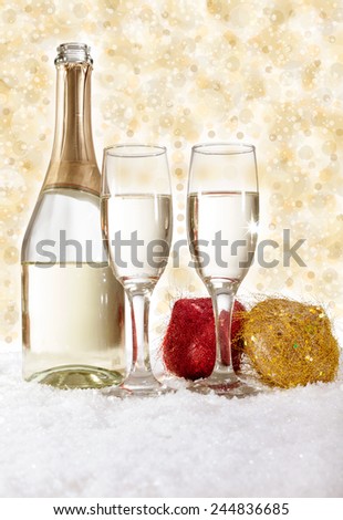 Champagne in glasses on golden background,new year concept
