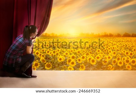 young woman in magic scene open curtain