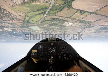 inside view in a glider, focus on the ground