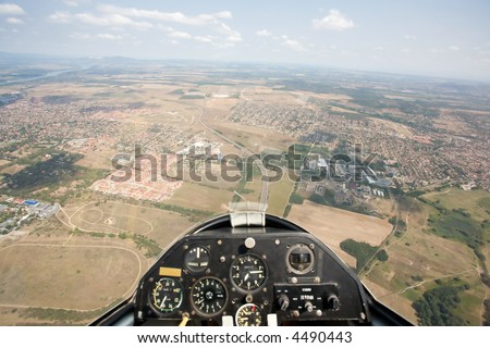 inside view in a glider, focus on the ground