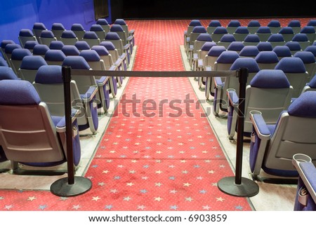 empty cinema auditorium with black cordon