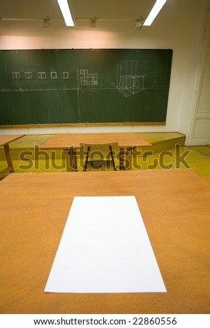 empty classroom and a paper on the desk